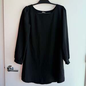 Tobi Long Sleeve Black Shift Mini Dress with Puff Shoulders